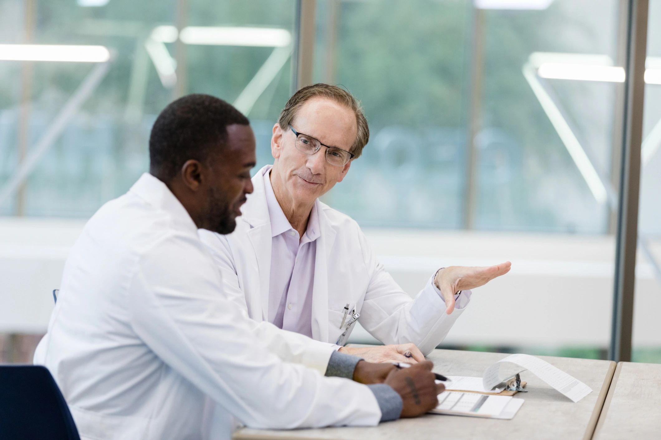 Doctors in discussion during a mentorship meeting