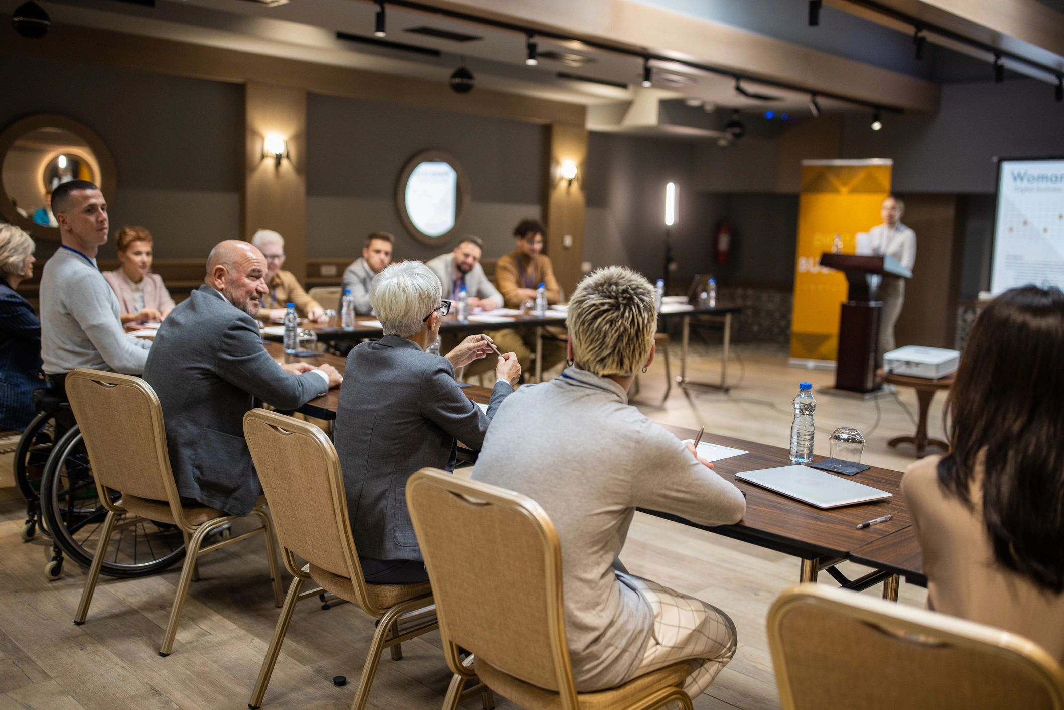 Conference audience listening to a speaker