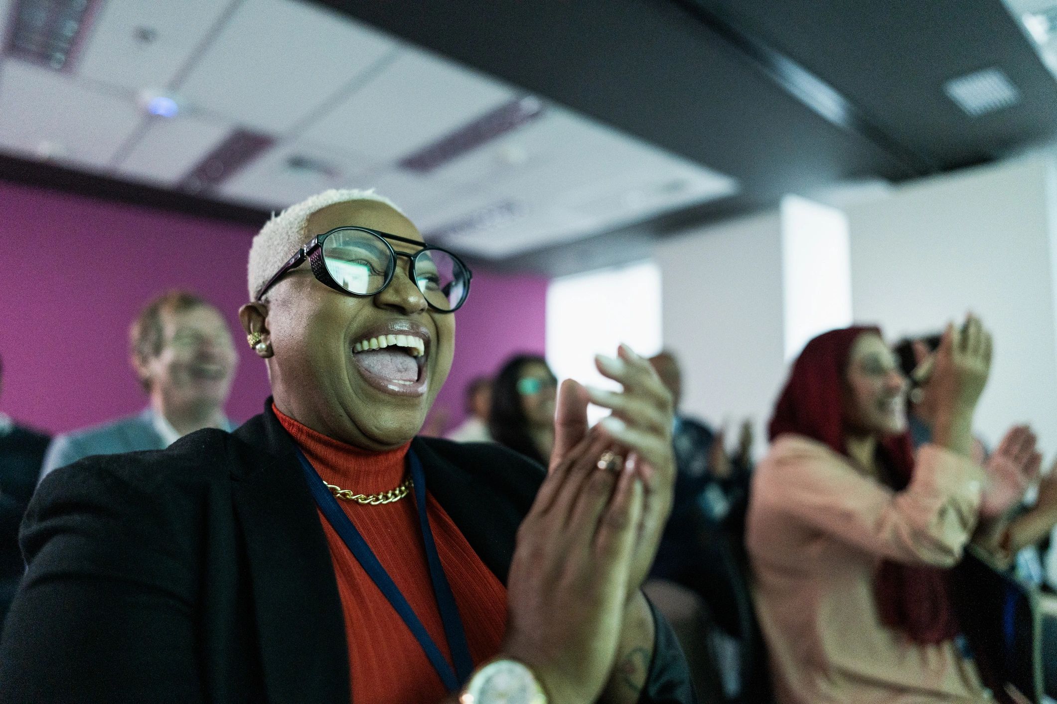 Audience applauding during a conference session