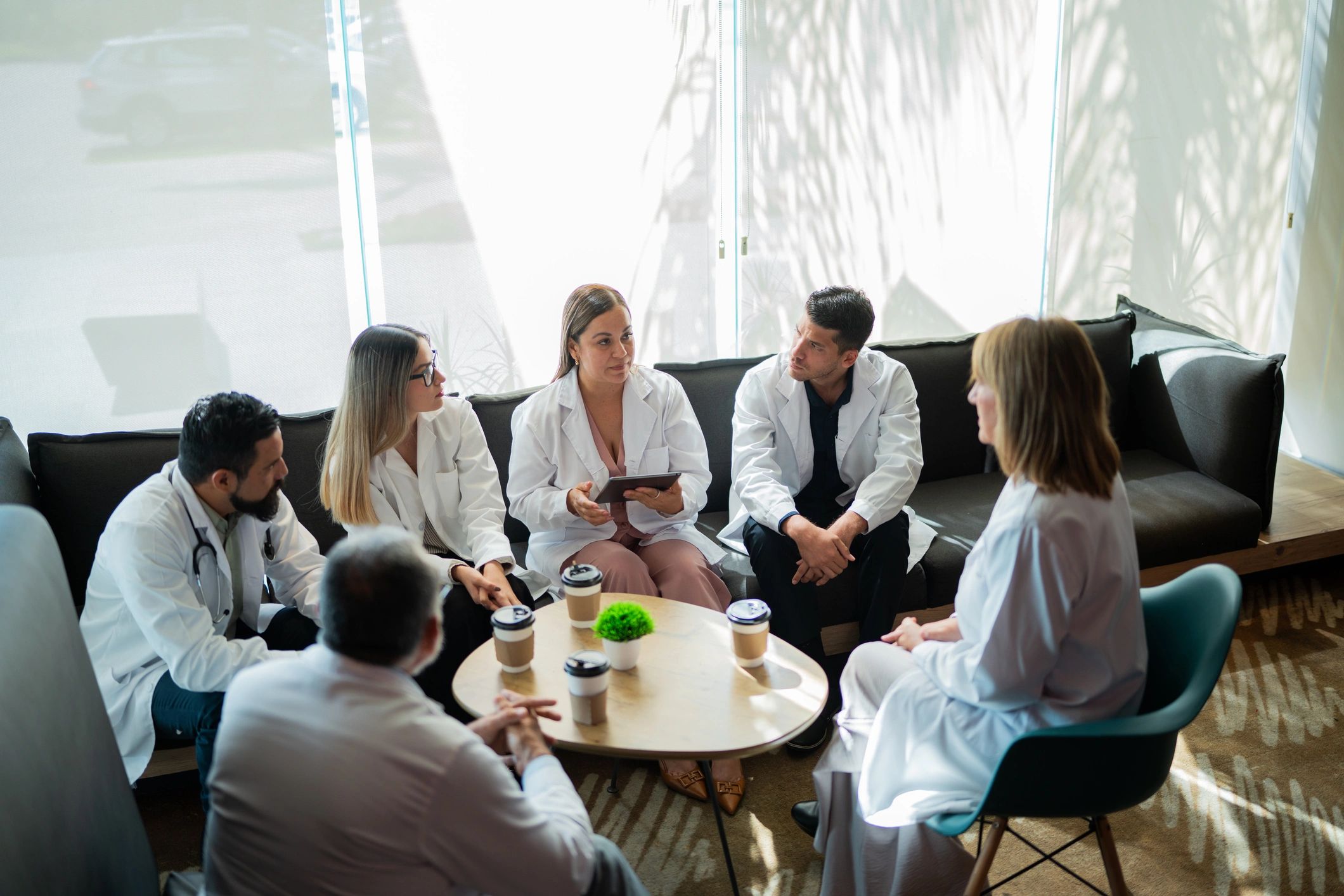 Doctors networking during a convention coffee break