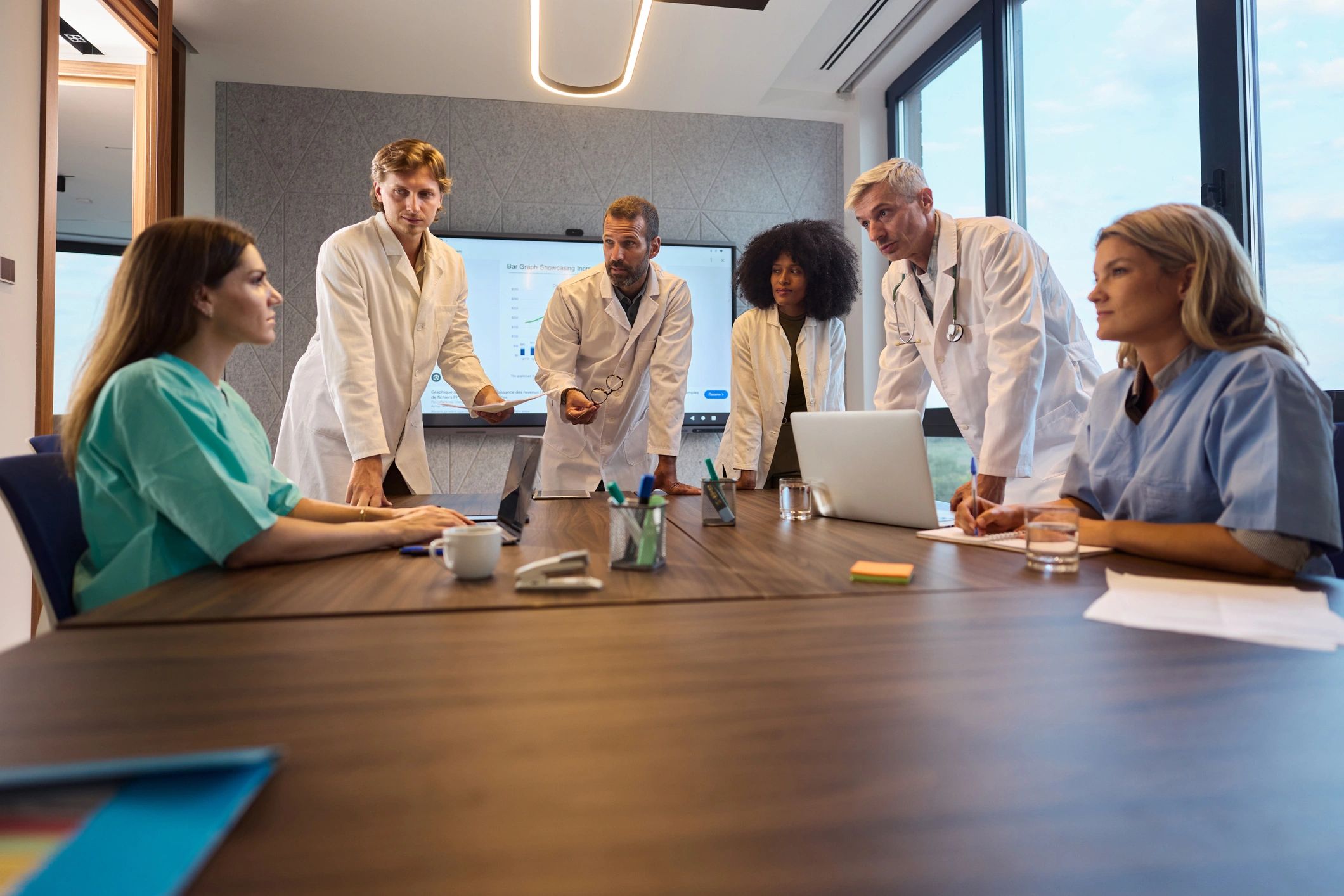 Doctors and professionals meeting and discussing in a modern office
