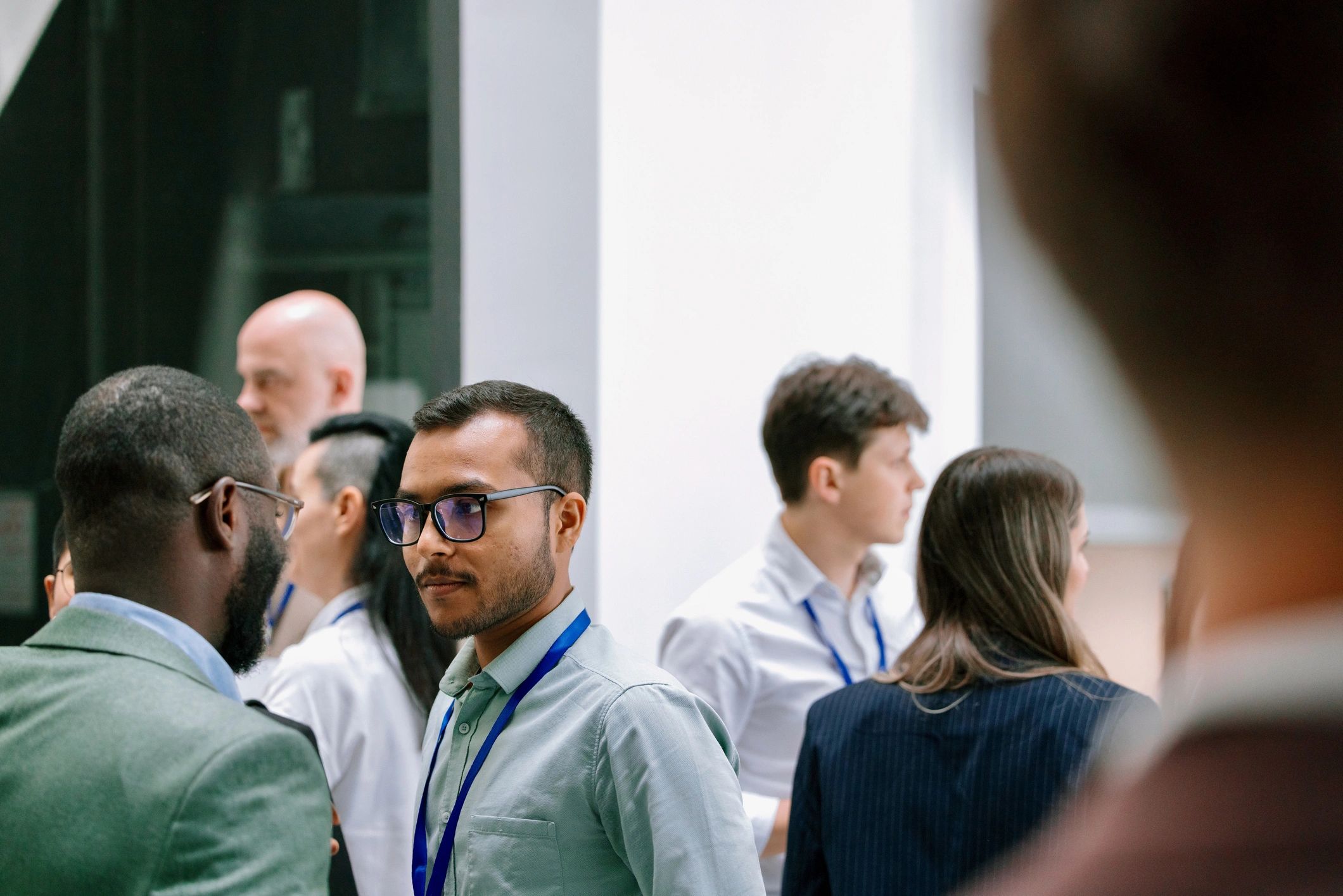 Alumni gathering together at a professional networking event